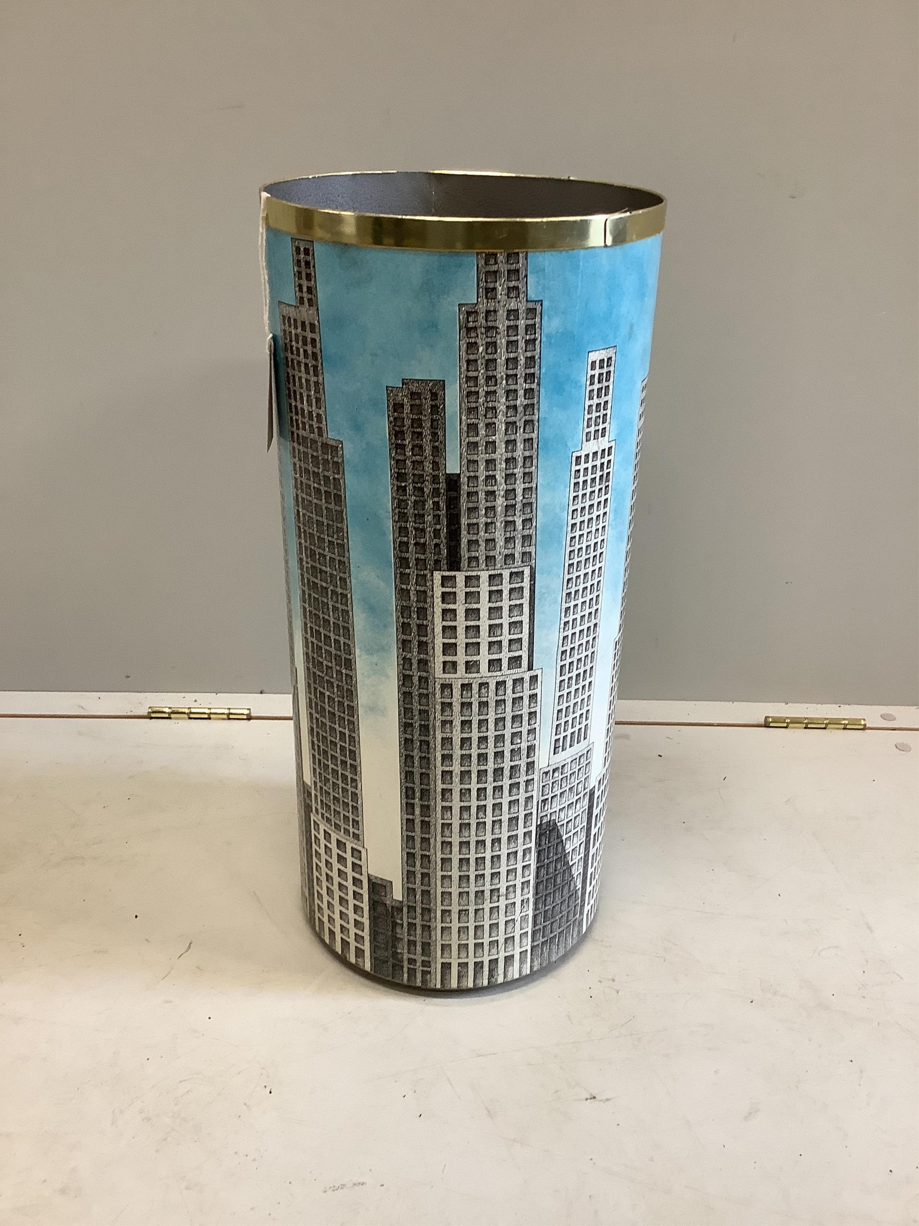 A Fornasetti Grattacieli stickstand, diameter 26cm, height 57cm